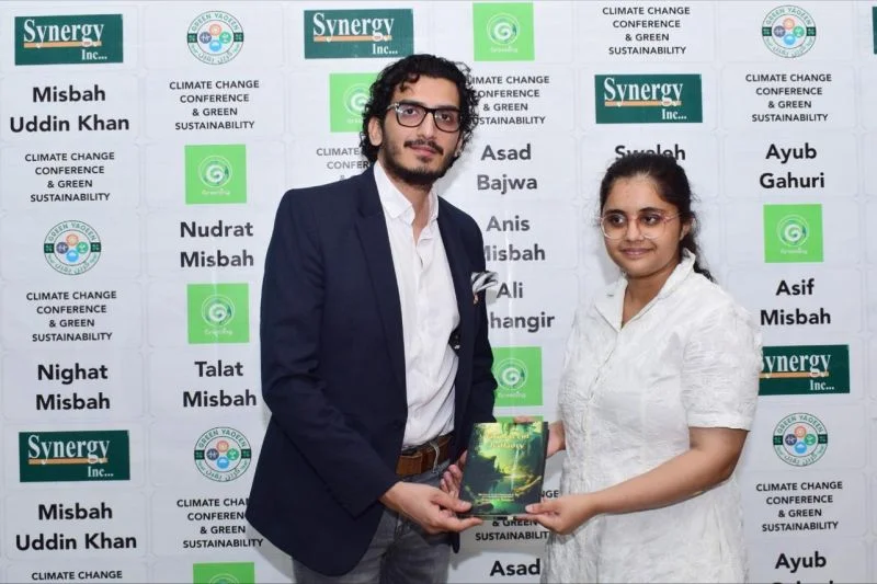 CEO Jawad Khan receiving book at LUMS